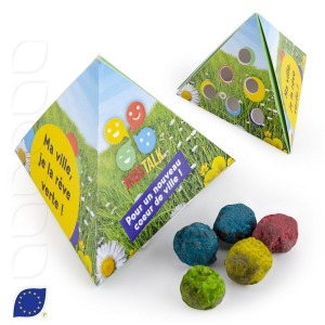 Seed balls in pyramid tins for sowing