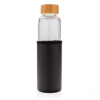 Glass bottle with textured cover